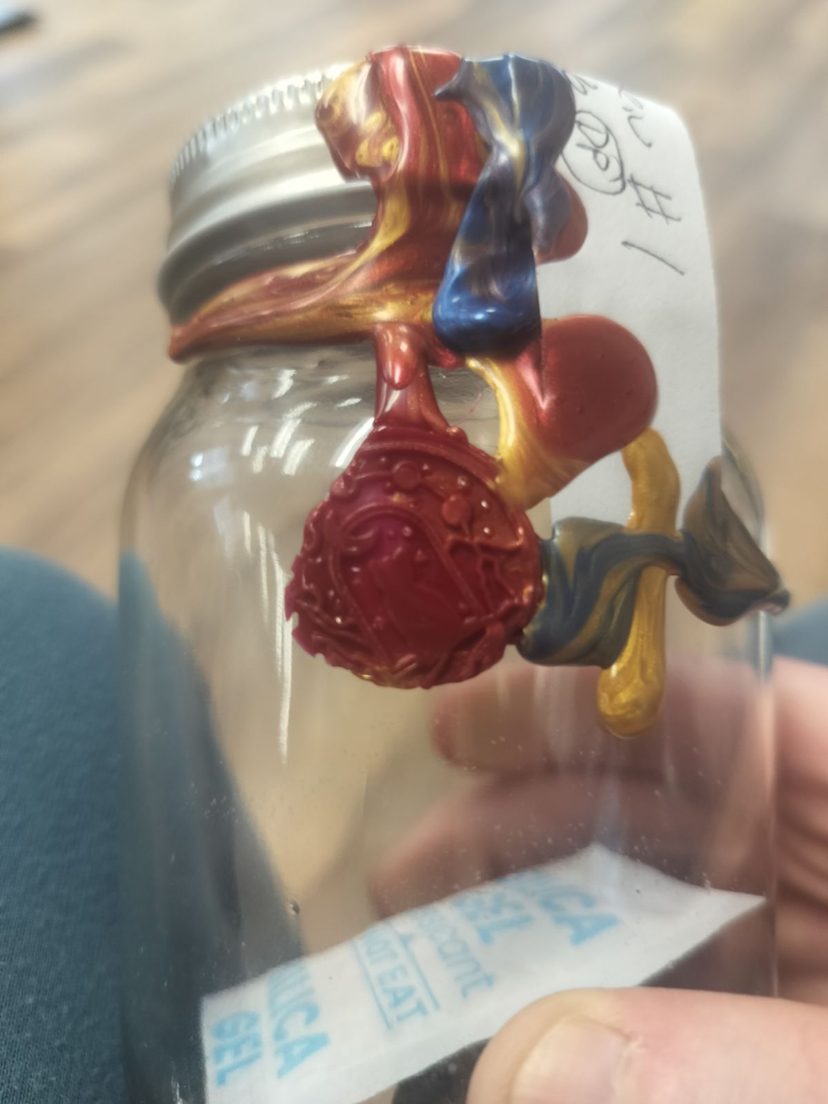 The stamped wax seal on the glass. Silica gel inside.