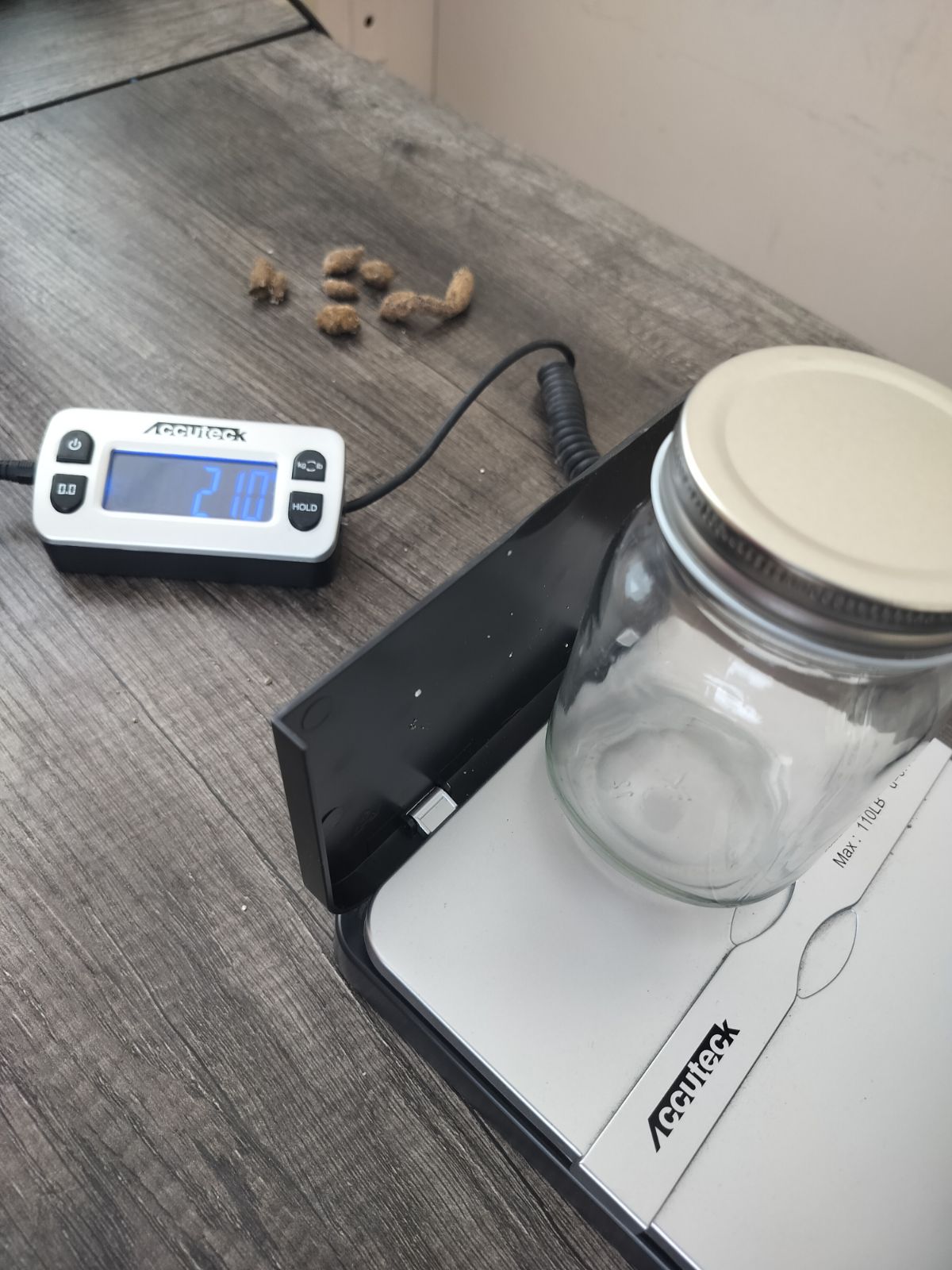 The jar, empty, with its lid.
